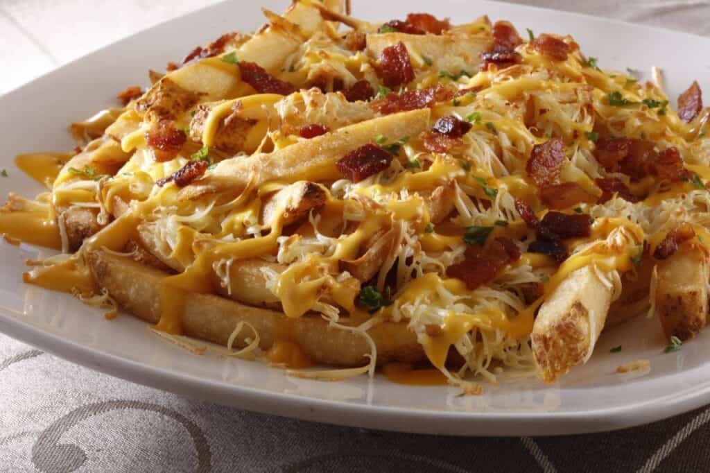 Level up your french fries and dig in to these Cheesy Baked Fries