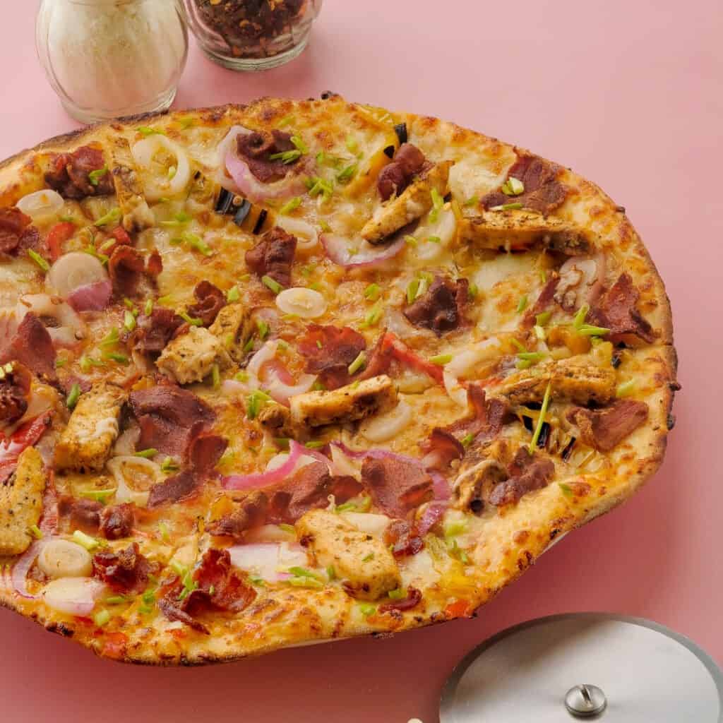 Yummy Jamaican Jerk Chicken Pizza available in California Pizza Kitchen