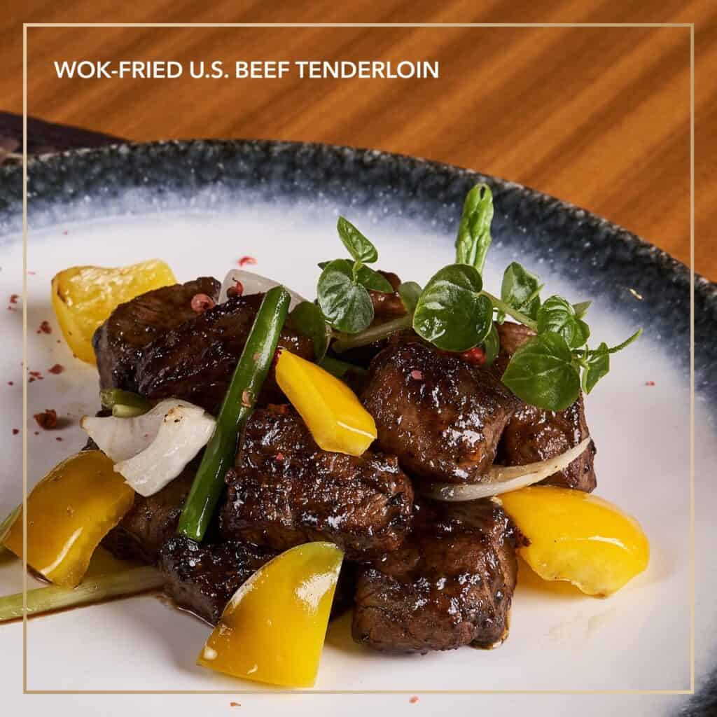 A best-seller menu dish in China Blue is the Wok-fried U.S. beef tenderloin, asparagus, and hunan pepper