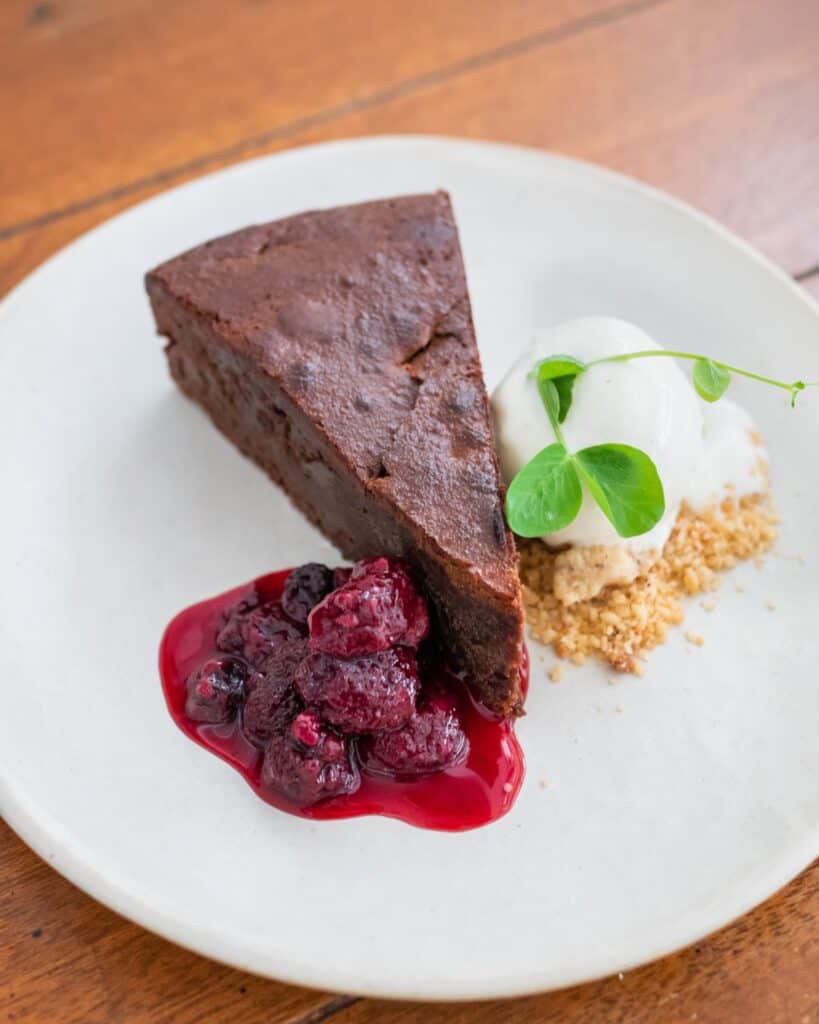 Tarta Chocolate with mix berries stew and ice cream