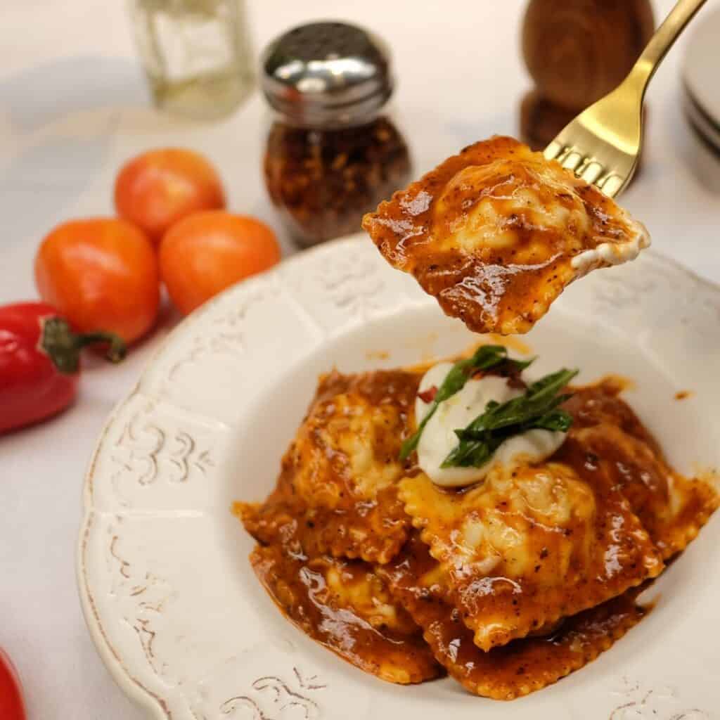 Italian sausage ravioli in romesco sauce