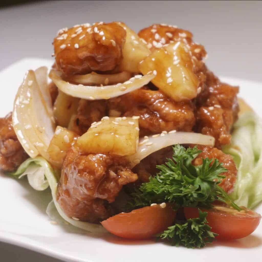 Deep-fried chicken and pineapple with jinjiang plum sauce
